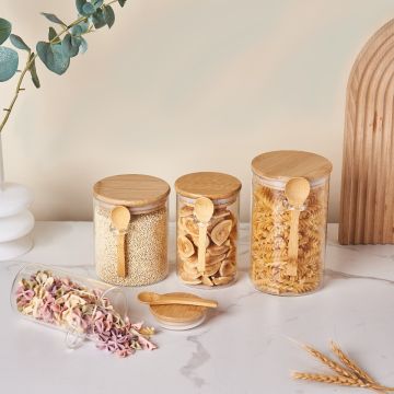 Round Borosilicate glass jar with a bamboo lid and spoon, ideal for kitchen storage