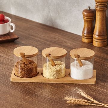 Round Glass jar set with bamboo lids and spoons on a wooden tray