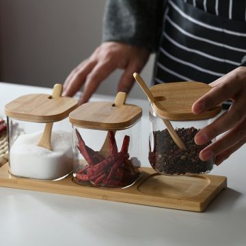 Square Glass jar set with bamboo lids and spoons on a wooden tray